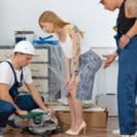 Two workers please a blonde